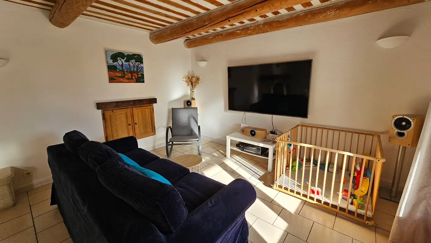 The sitting area with the sofa and television