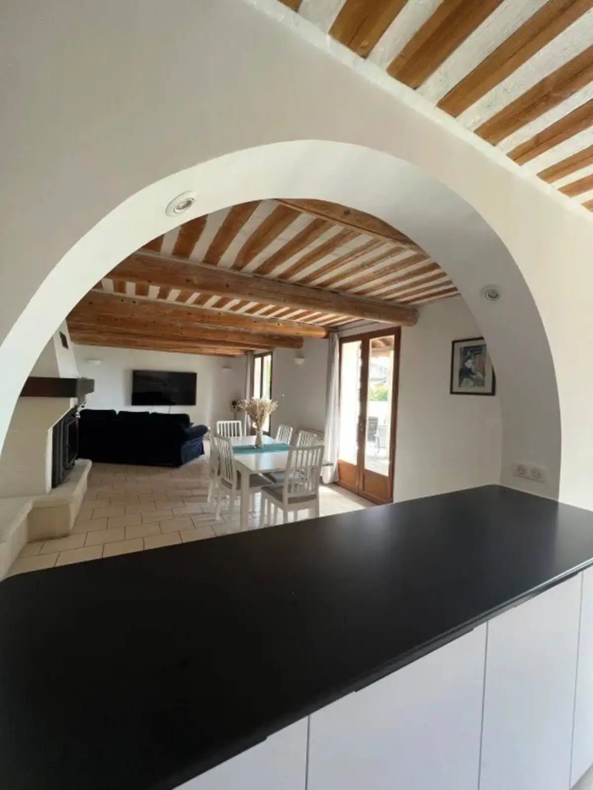 The living room seen from the kitchen, through the large archway
