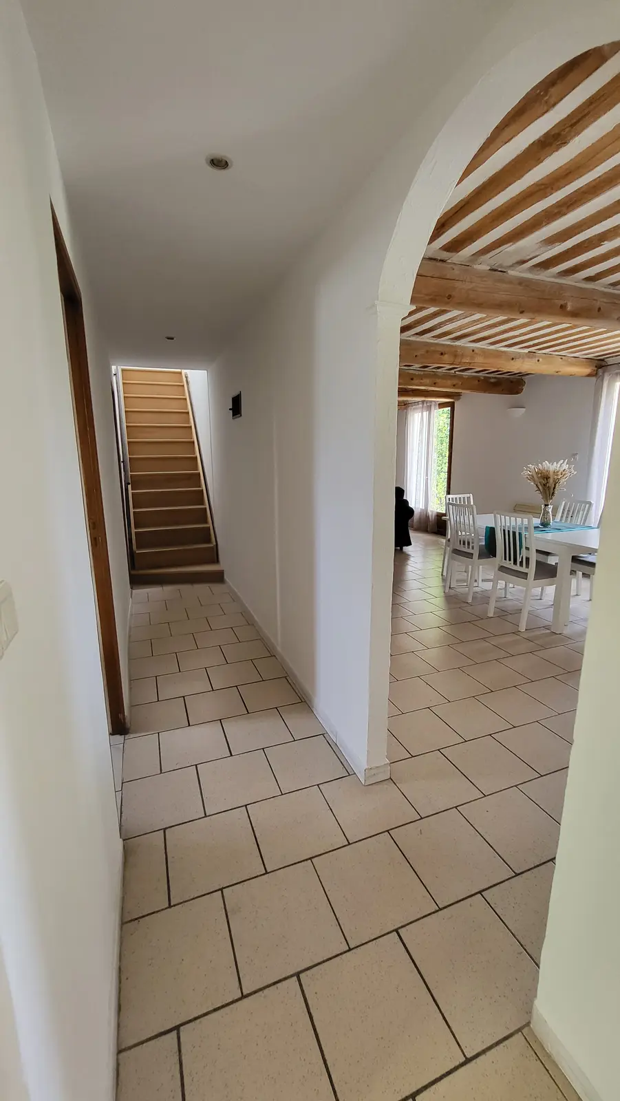 The hallway and the staircase to the upper floor